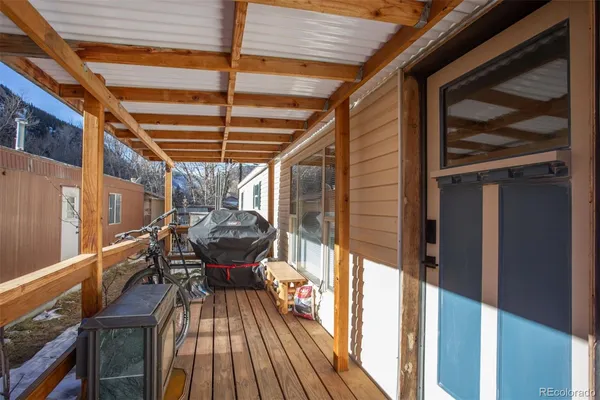 a view of a balcony with furniture