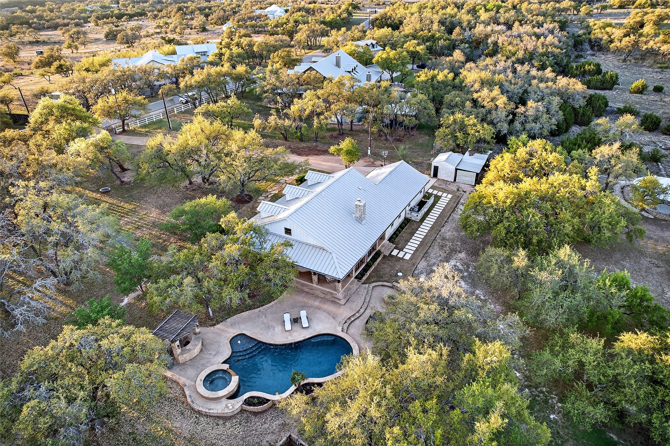 301 Medlin Creek Loop Dripping Springs, TX 78620 - Photo 1 of 40 an aerial view of a house with outdoor space