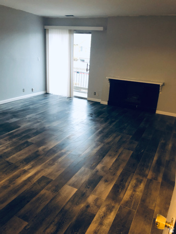 88 West 50 South, Unit B5 Centerville, UT 84014 - Photo 18 of 33 Unfurnished living room with dark wood finished floors and baseboards