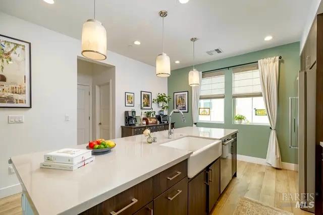 Additional upgrades include a deep basin farm sink and stylish light fixtures.