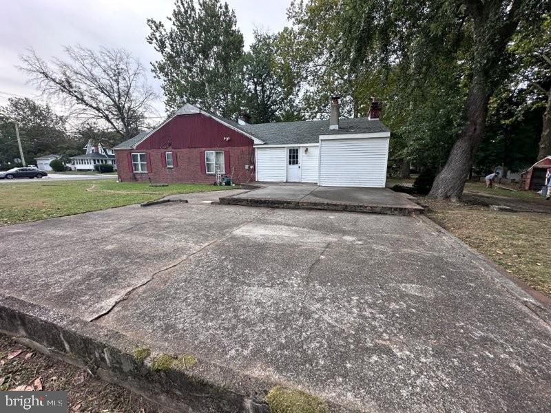 245 Gibbsboro Road Clementon, NJ 08021 - Photo 3 of 29 a front view of a house with a yard and garage