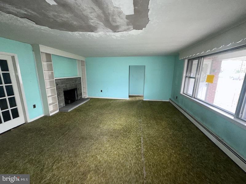 245 Gibbsboro Road Clementon, NJ 08021 - Photo 8 of 29 a view of an empty room with window and fire place