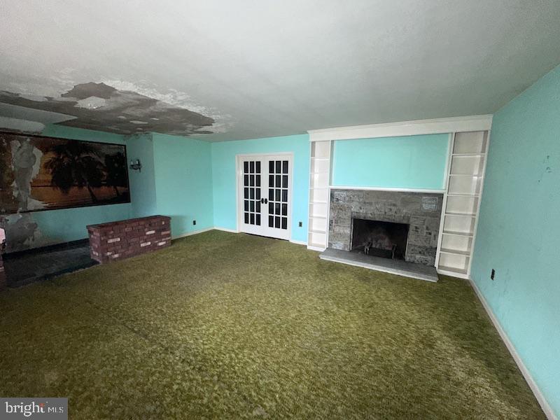 245 Gibbsboro Road Clementon, NJ 08021 - Photo 10 of 29 a view of an empty room with a fireplace and a window