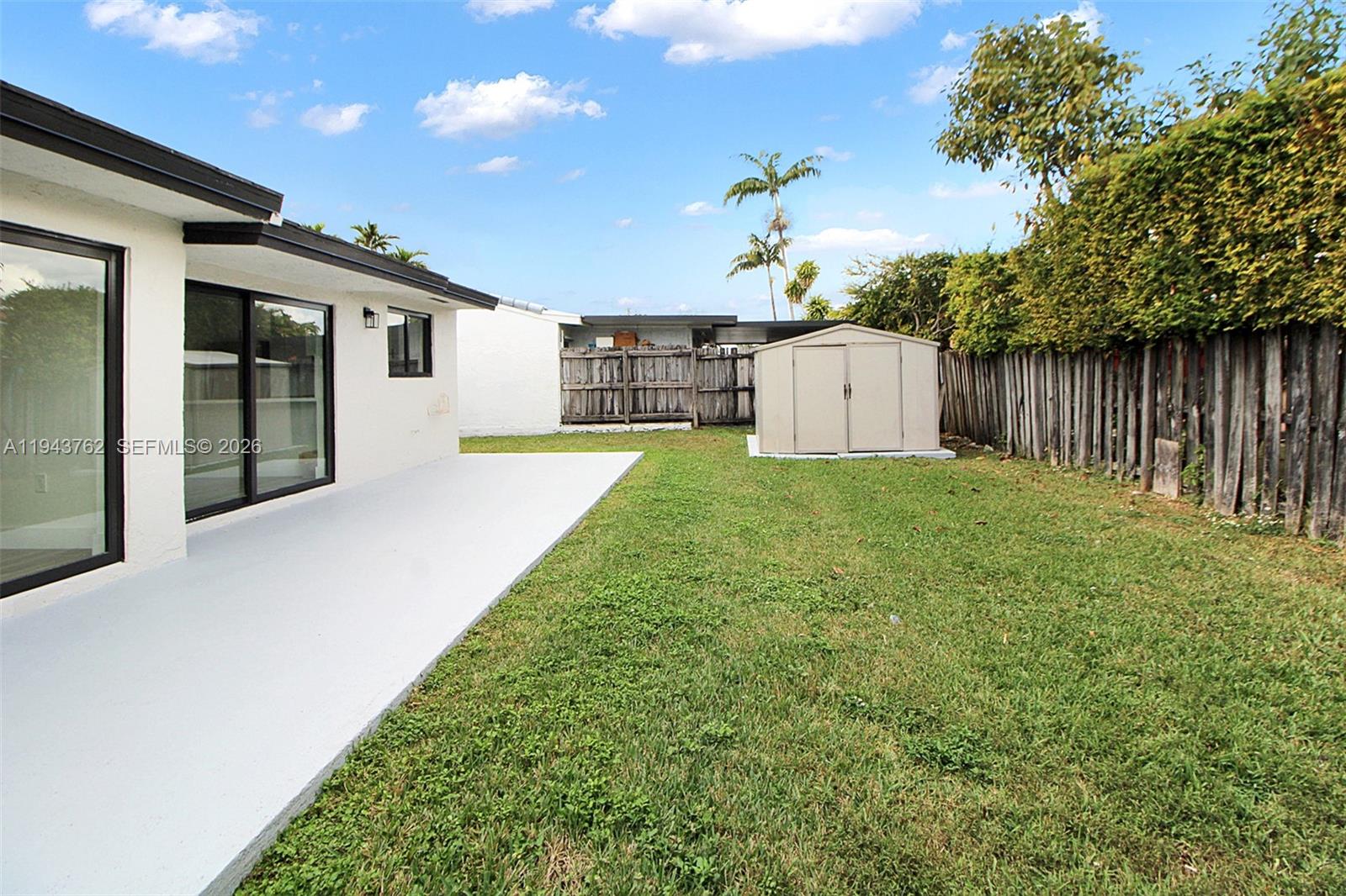 13379 Northwest 3rd Terrace Miami, FL 33182 - Photo 21 of 23 a view of a house with a yard and garage