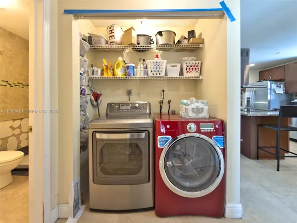 a utility room with dryer and washer