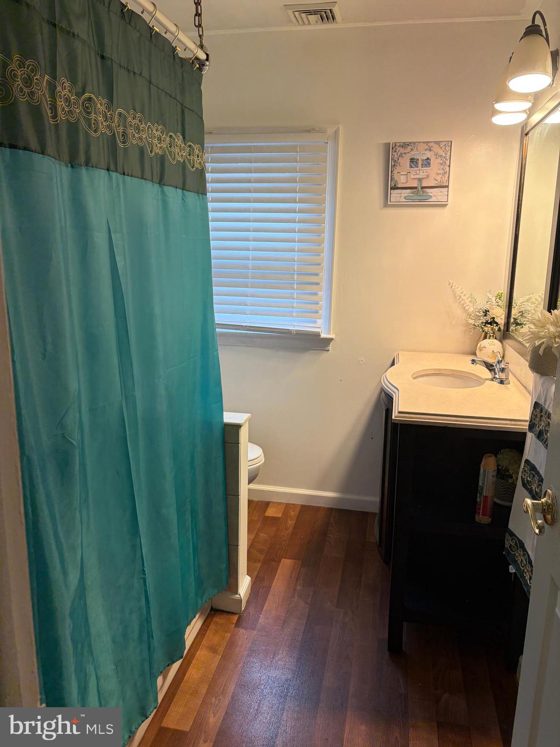 7404 Wyndam Road Pennsauken, NJ 08110 - Photo 34 of 50 a bathroom with a sink and a mirror