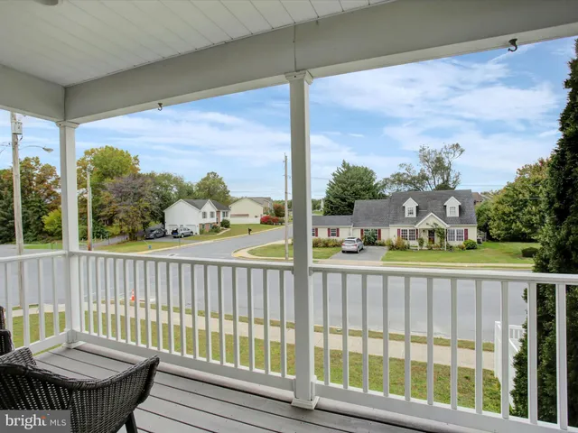 a view of a balcony with chairs