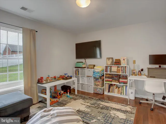 a room with furniture and a flat screen tv