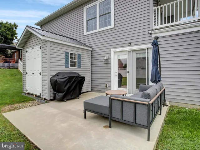 a bedroom with furniture and a flat screen tv