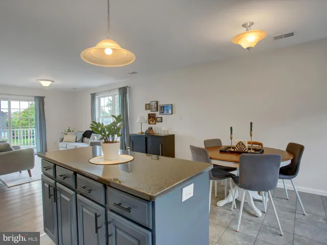 a kitchen with a table and chairs in it