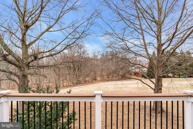 a view of a wooden fence of trees