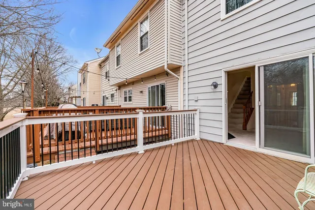 a view of a wooden deck with a yard