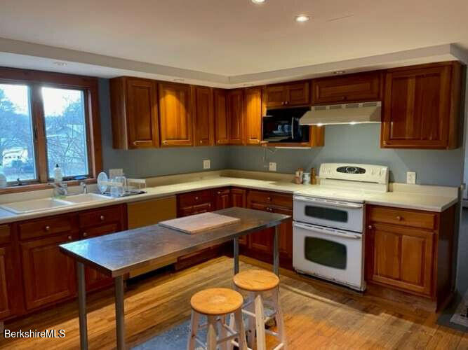 5 Seekonk Road Great Barrington, MA 01230 - Photo 19 of 19 a kitchen with a stove sink and cabinets