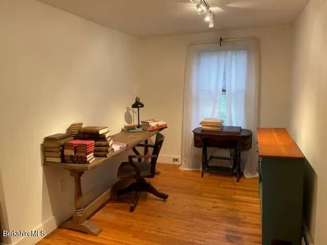 a view of a workspace with furniture