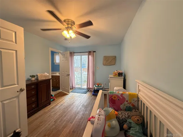 a bed room with a bed and a chandelier