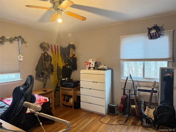 a view of a workspace with furniture and gym equipment