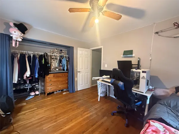 a view of a workspace with furniture and gym equipment