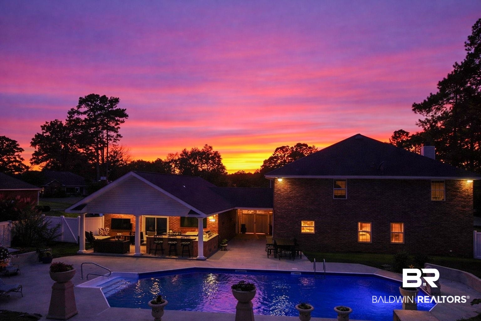 2 Speckle Trout Route Daphne, AL 36527 - Photo 4 of 61 Rear view of house with an outdoor bar and dining area, a patio area, an outdoor pool, and a chimney