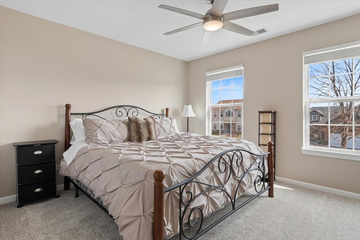 724 North Misty Ridge Drive Romeoville, IL 60446 - Photo 16 of 26 a bedroom with a bed and a window