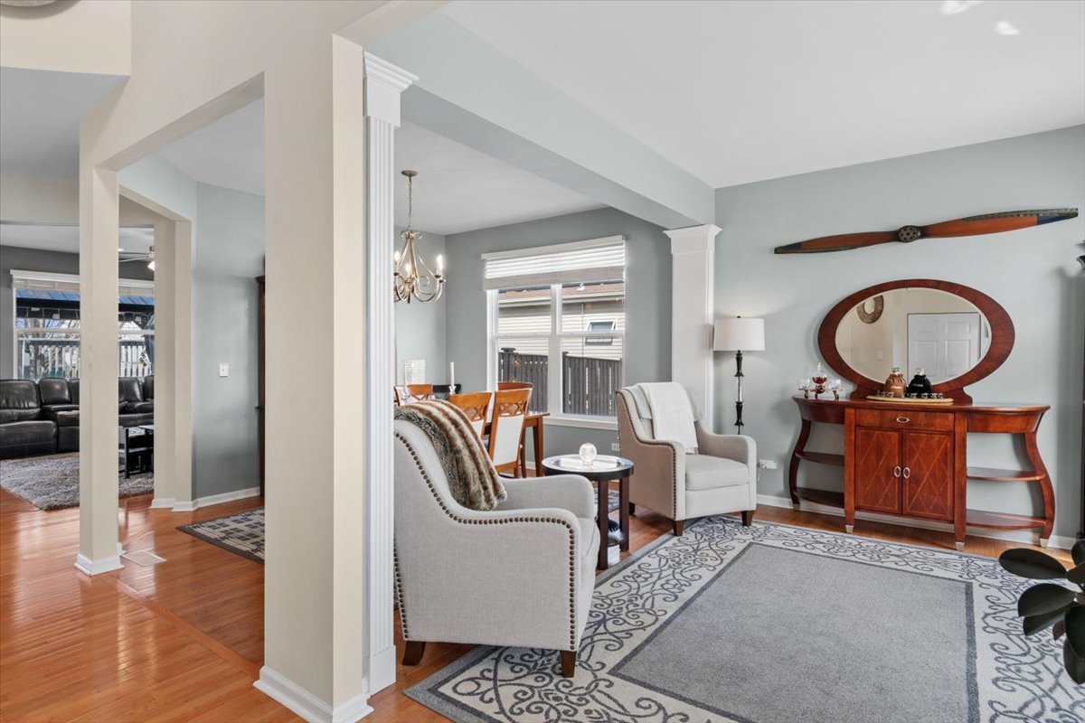 724 North Misty Ridge Drive Romeoville, IL 60446 - Photo 3 of 26 a living room with furniture and a window