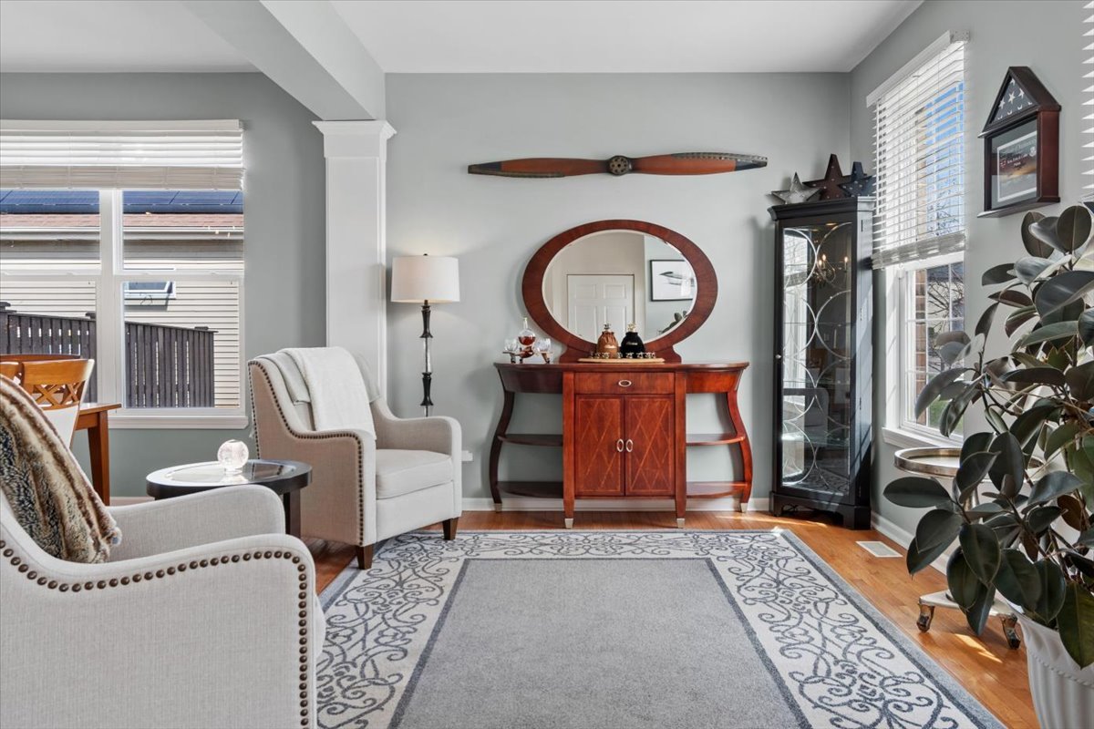 724 North Misty Ridge Drive Romeoville, IL 60446 - Photo 4 of 26 a living room with furniture a flat screen tv and a fireplace