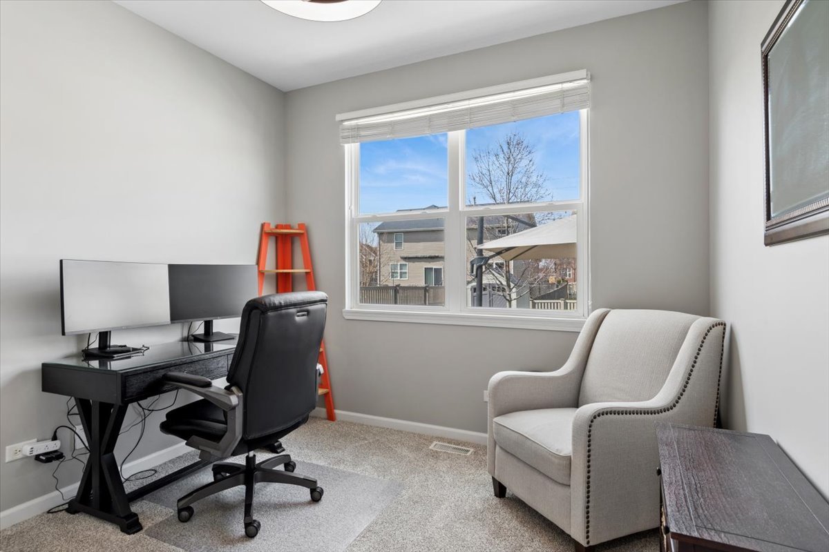 724 North Misty Ridge Drive Romeoville, IL 60446 - Photo 8 of 26 a work room with furniture and a window