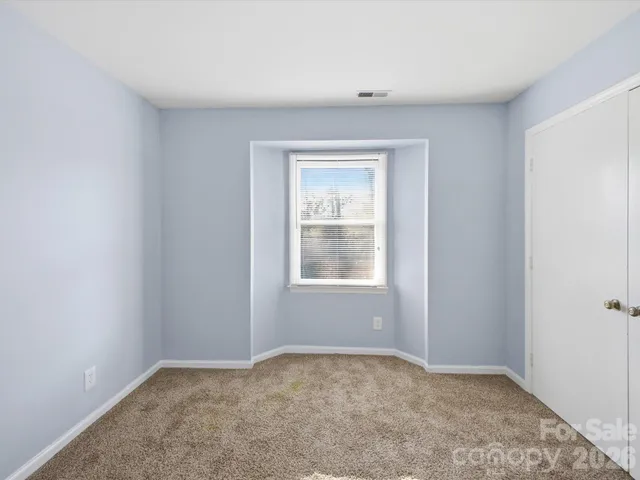 a view of a bedroom with window