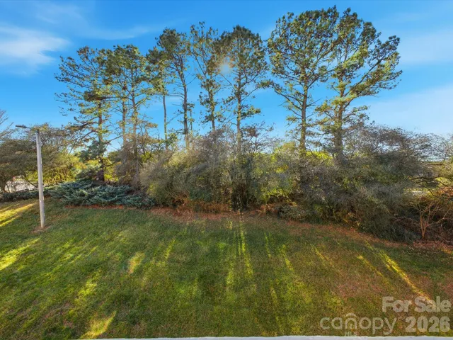a view of houses with yard