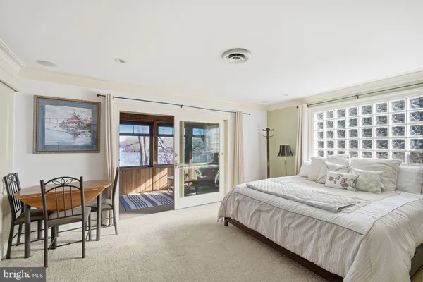 a bedroom with furniture and a window