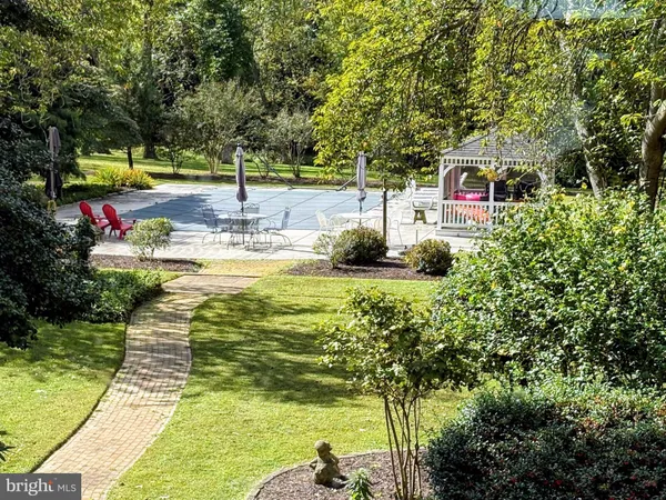 a view of a swimming pool with a patio
