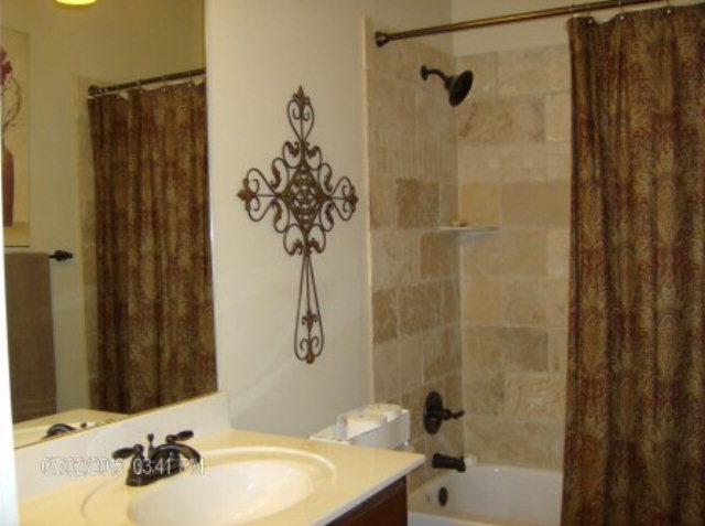 121 Laurel Ridge Forsyth, GA 31029 - Photo 14 of 19 a bathroom with a sink and a mirror