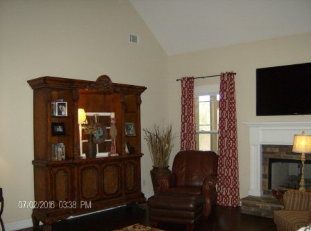121 Laurel Ridge Forsyth, GA 31029 - Photo 4 of 19 a living room with furniture and a flat screen tv