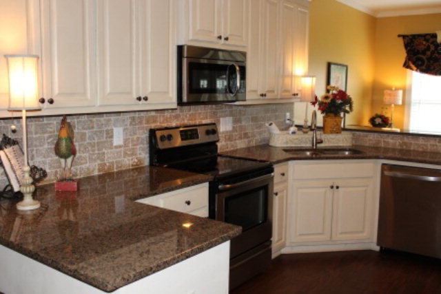 121 Laurel Ridge Forsyth, GA 31029 - Photo 8 of 19 a kitchen with sink and cabinets