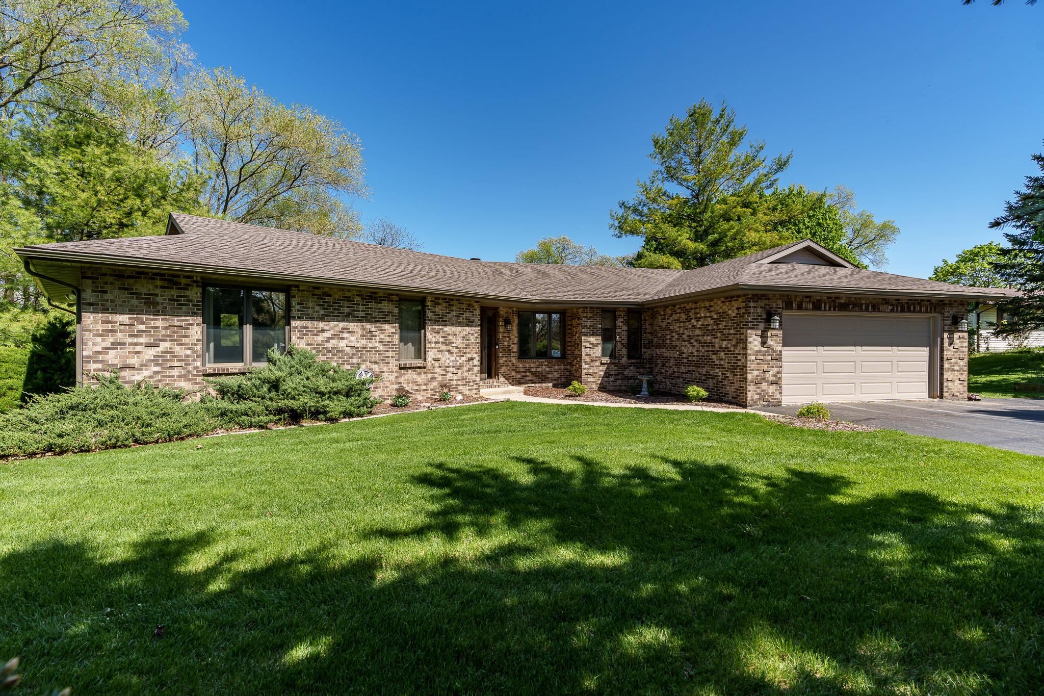 10249 Atwood Road Roscoe, IL 61073 - Photo 1 of 58 a front view of a house with a yard