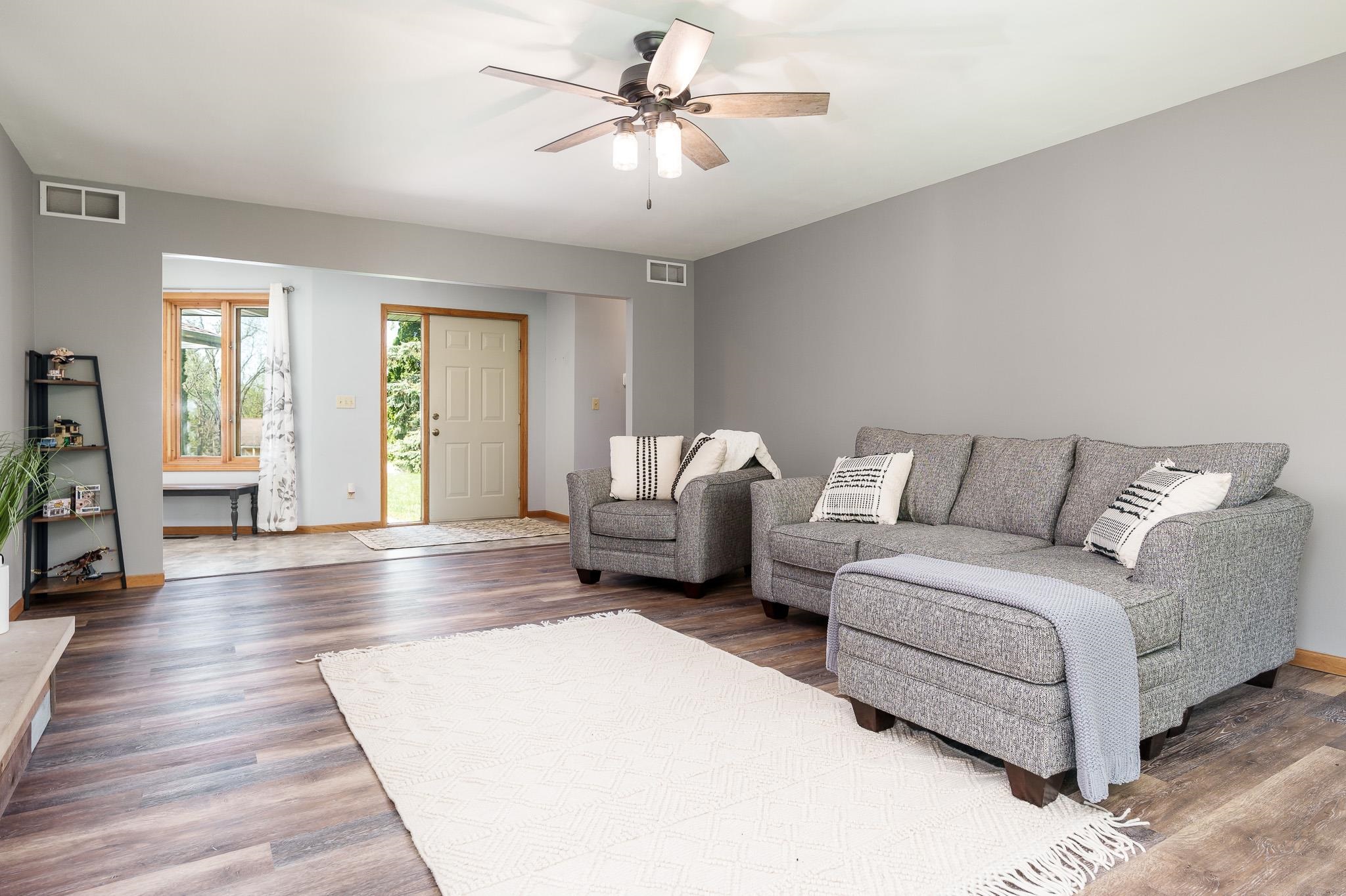 10249 Atwood Road Roscoe, IL 61073 - Photo 13 of 58 a living room with furniture and a large window