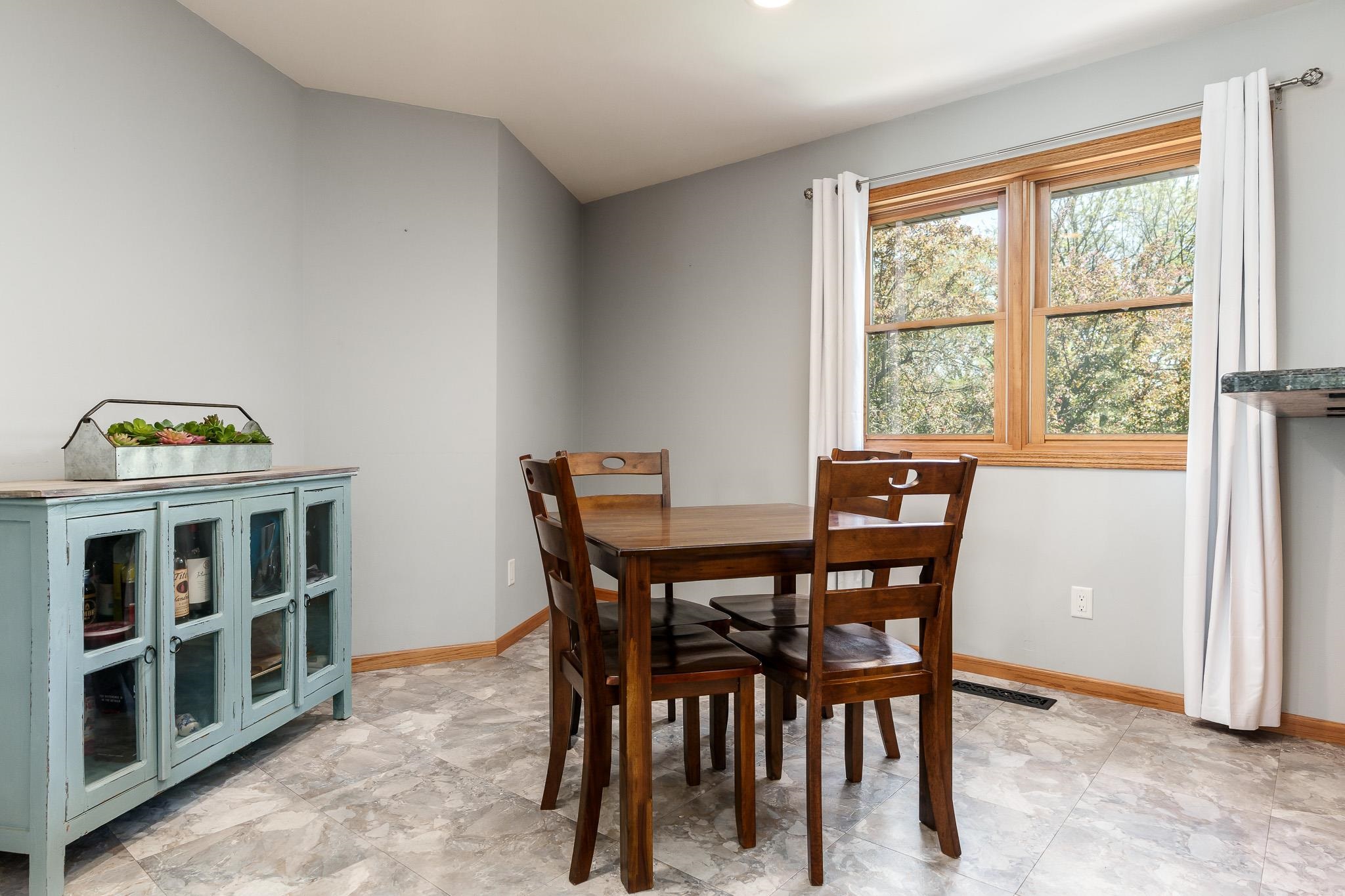 10249 Atwood Road Roscoe, IL 61073 - Photo 14 of 58 a view of a dining room with furniture and window