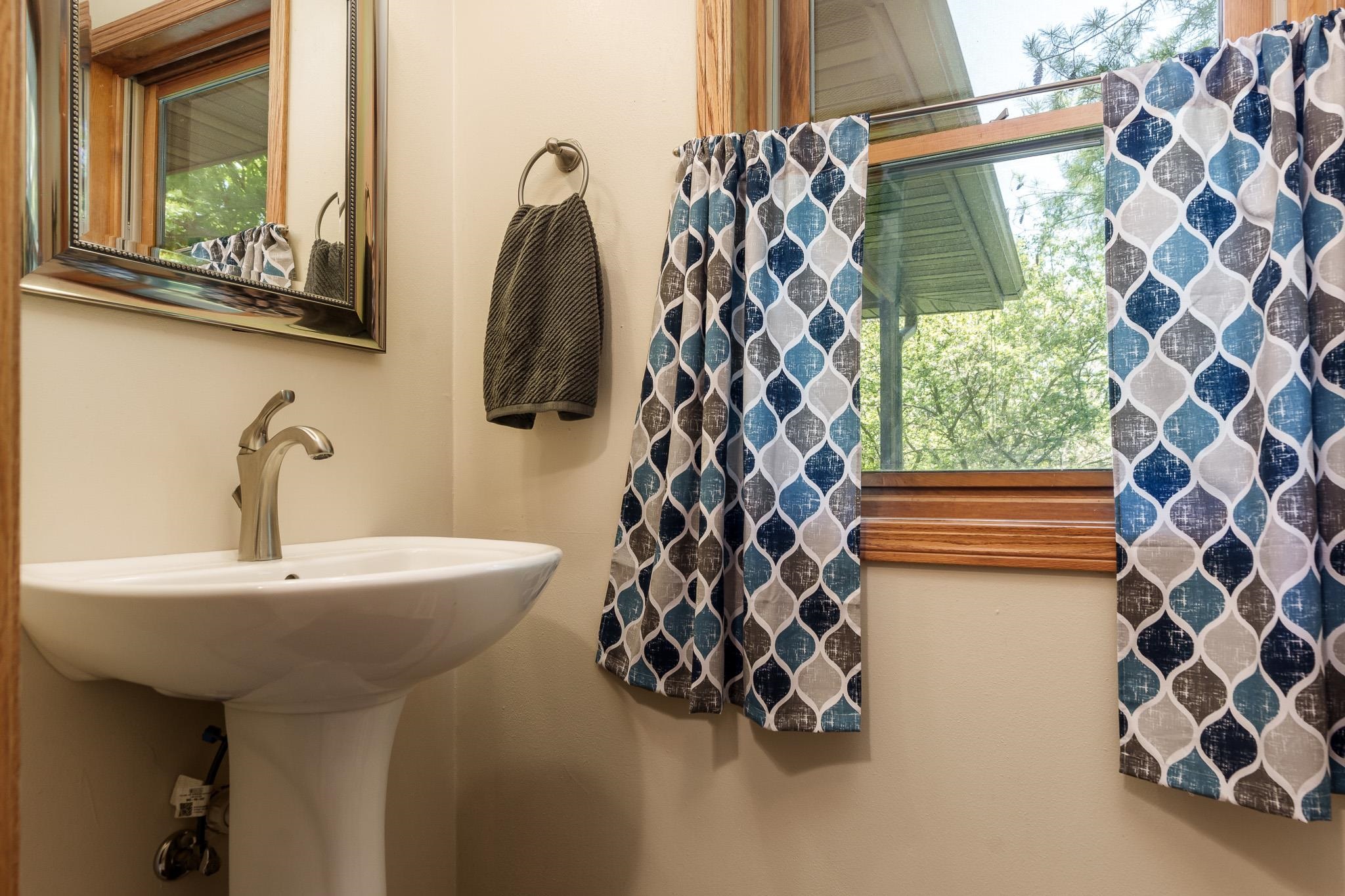 10249 Atwood Road Roscoe, IL 61073 - Photo 24 of 58 a bathroom with a sink and a mirror