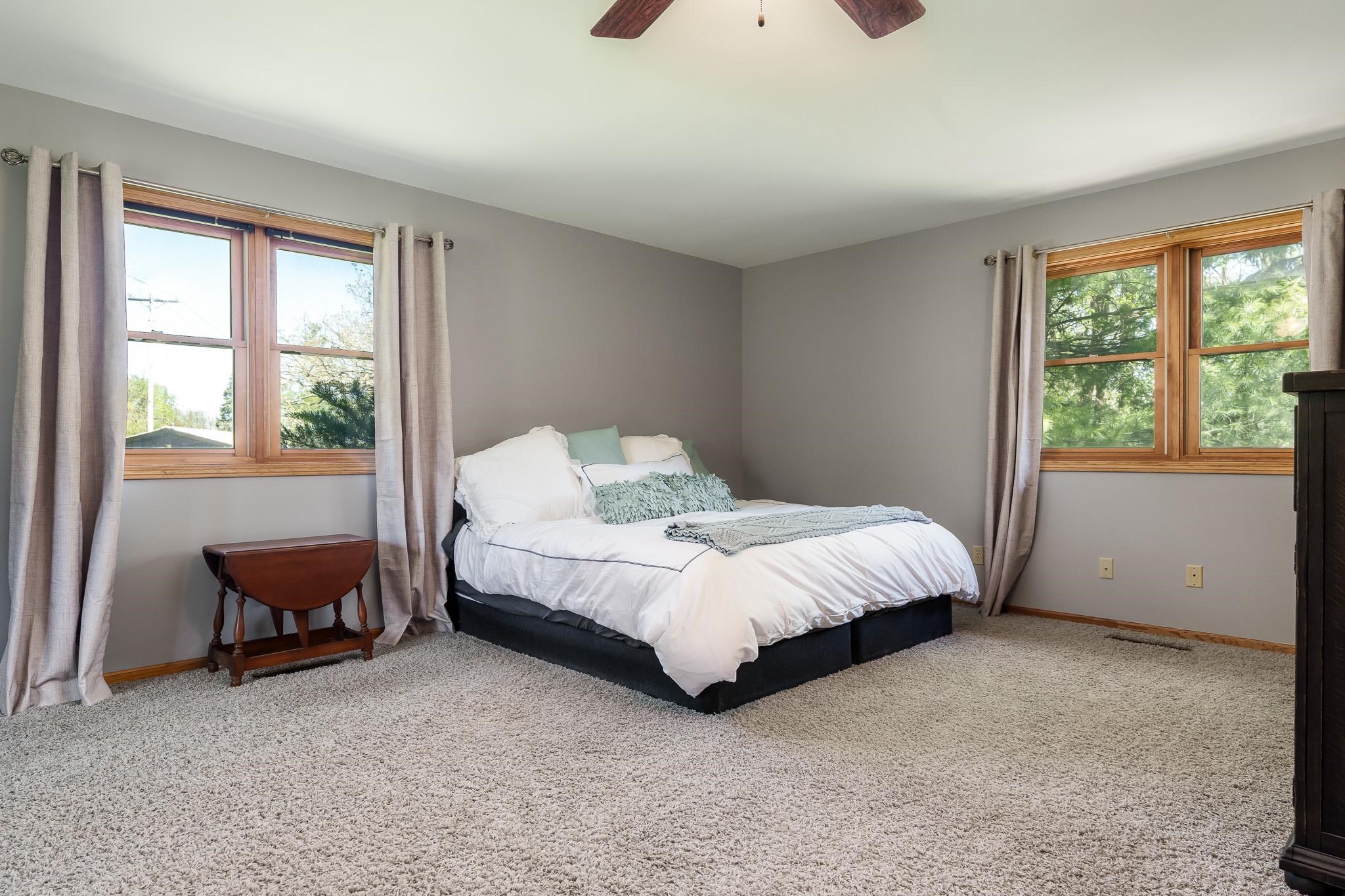 10249 Atwood Road Roscoe, IL 61073 - Photo 25 of 58 a bed sitting in a bedroom next to a window