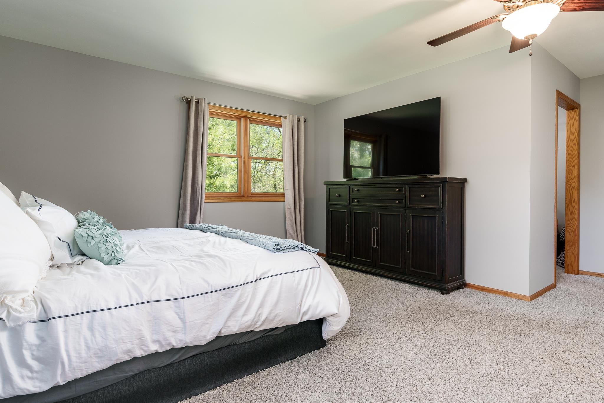 10249 Atwood Road Roscoe, IL 61073 - Photo 26 of 58 a bedroom with a bed and a television