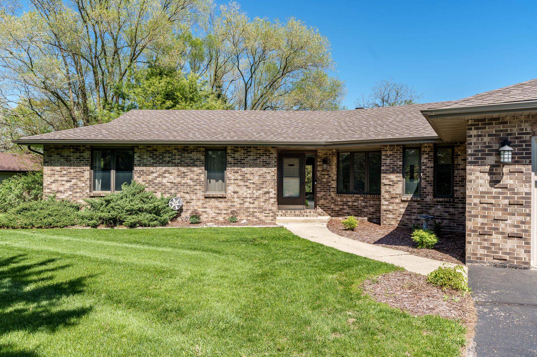 10249 Atwood Road Roscoe, IL 61073 - Photo 3 of 58 a view of a house with backyard porch and sitting area