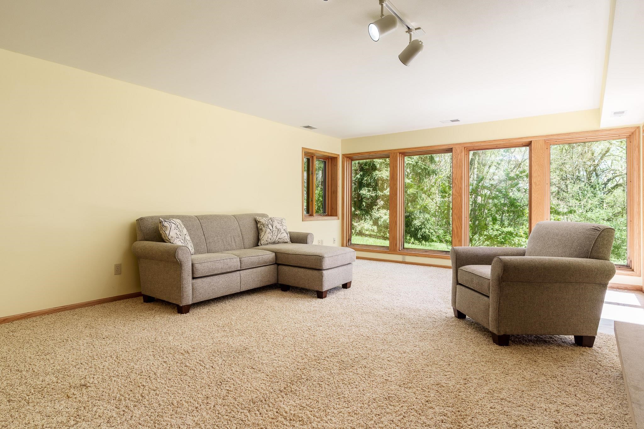 10249 Atwood Road Roscoe, IL 61073 - Photo 31 of 58 a living room with furniture and a large window