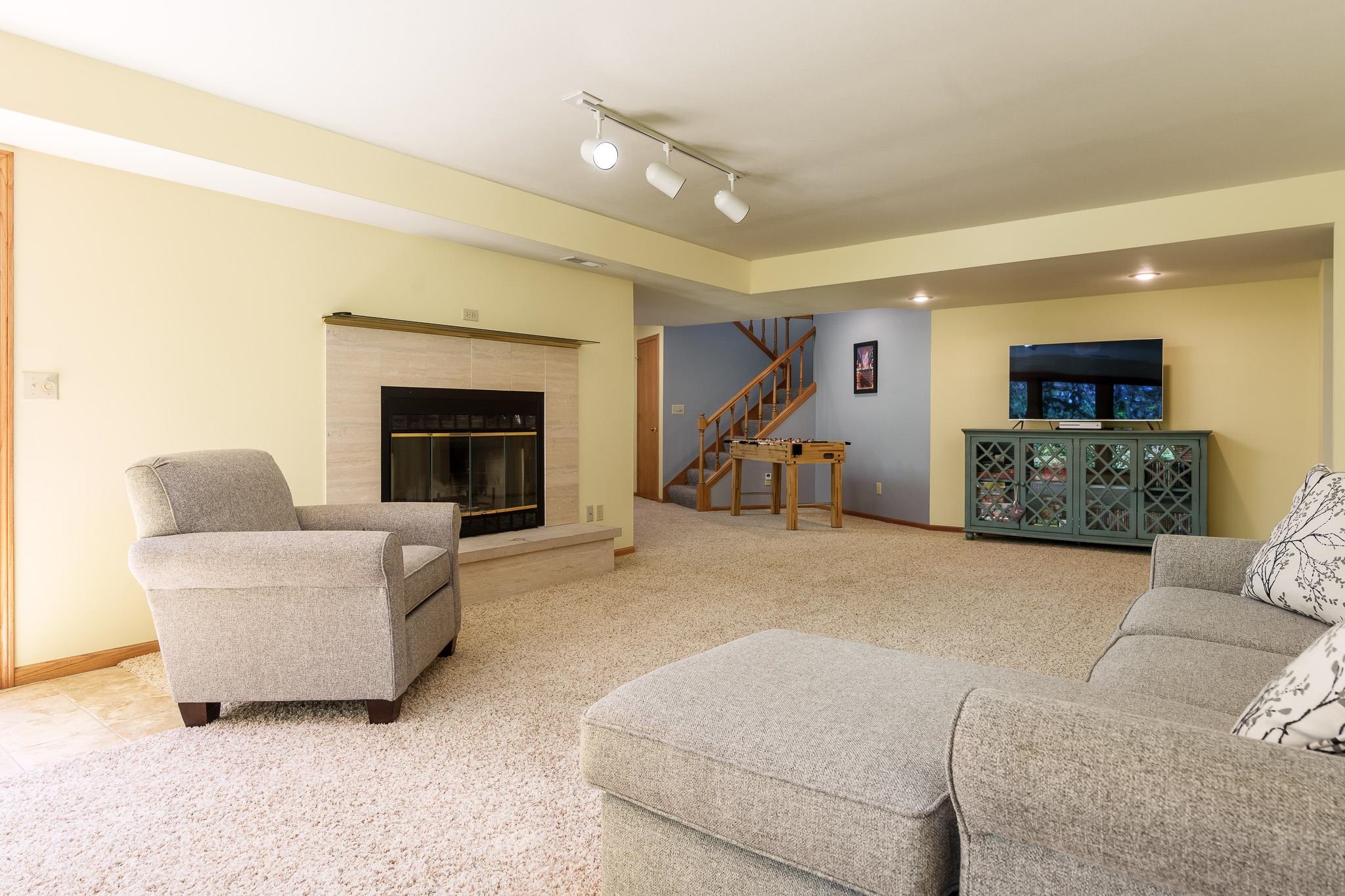 10249 Atwood Road Roscoe, IL 61073 - Photo 33 of 58 a living room with furniture and a fireplace