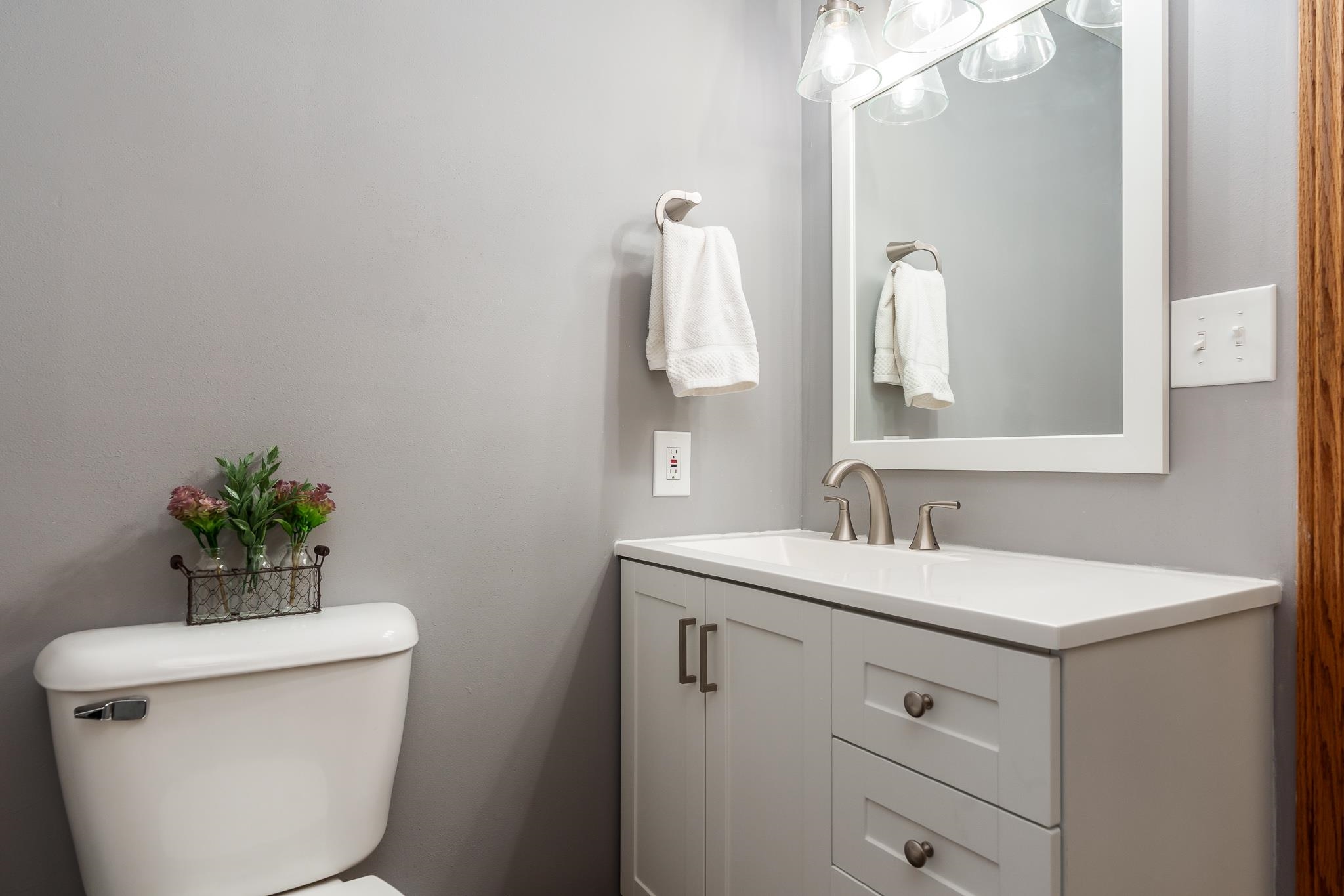 10249 Atwood Road Roscoe, IL 61073 - Photo 41 of 58 a bathroom with a toilet sink and mirror