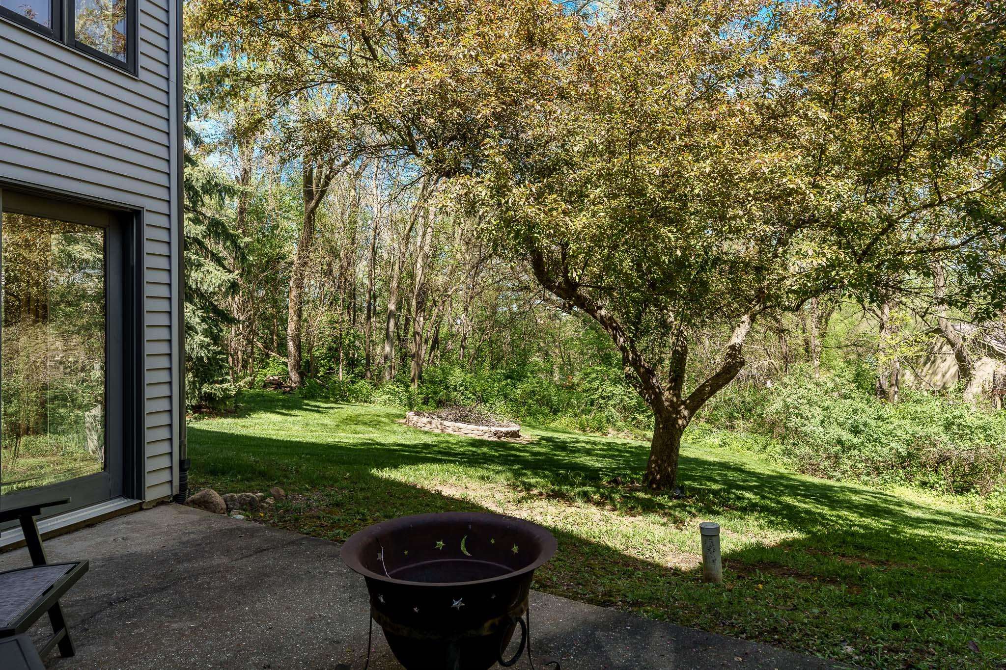 10249 Atwood Road Roscoe, IL 61073 - Photo 50 of 58 a view of a backyard with large trees
