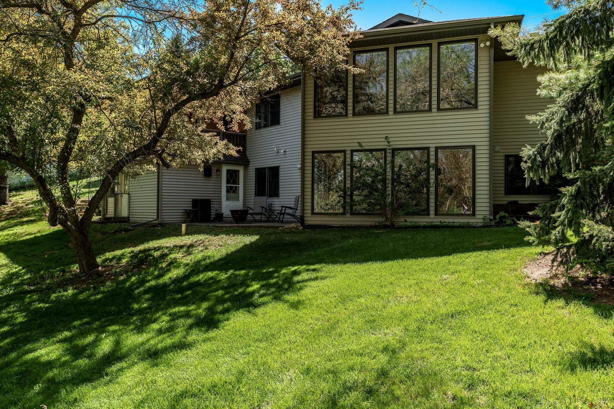 10249 Atwood Road Roscoe, IL 61073 - Photo 51 of 58 a front view of a house with garden
