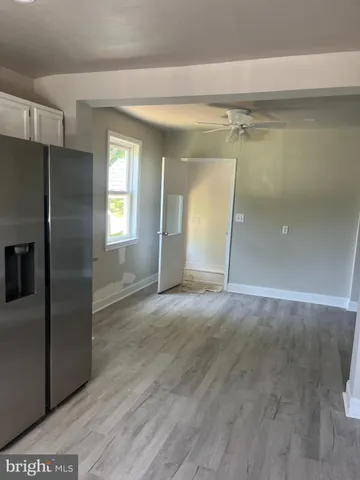 a view of empty room with a fireplace