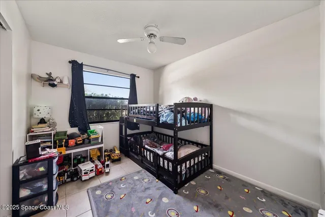 a bedroom with furniture a rug and a window