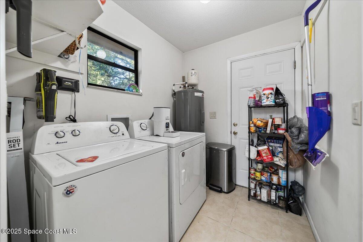 5575 Curtis Boulevard Cocoa, FL 32927 - Photo 19 of 25 a utility room with dryer and washer