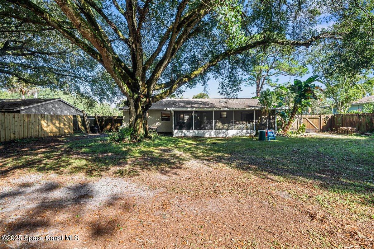 5575 Curtis Boulevard Cocoa, FL 32927 - Photo 24 of 25 a front view of a house with a yard