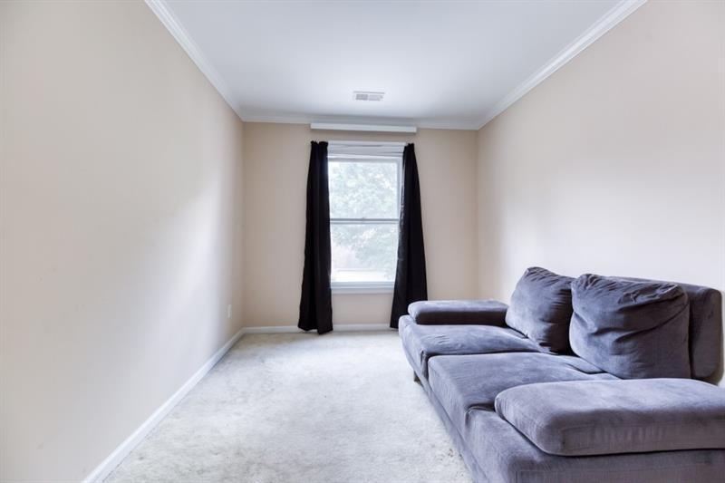 1008 Post Horn Run Lawrenceville, GA 30045 - Photo 18 of 64 a living room with furniture and a window
